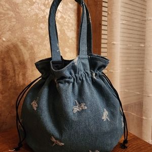 Denim dragonfly drawstring tote bag